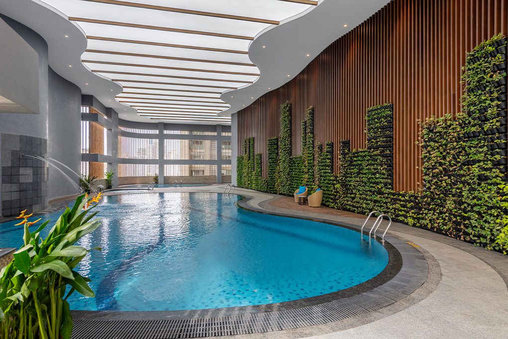 Indoor swimming pool with green living walls